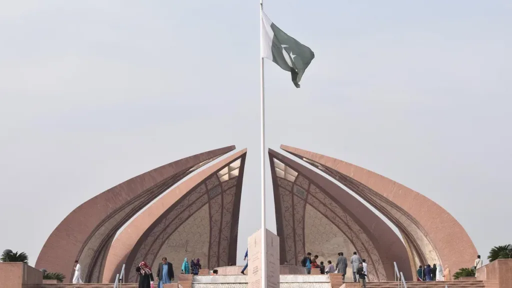 Pakistan Monument in Islamabad with its petal-shaped granite wings and the national flag flying above visitors
