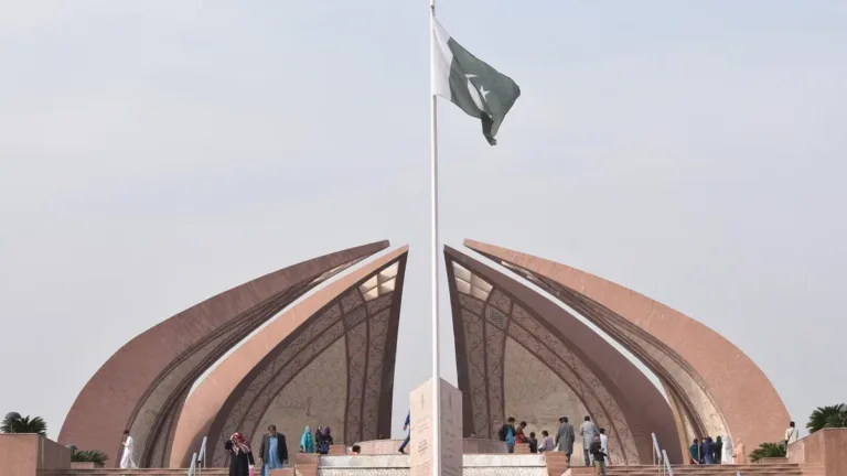Pakistan Monument in Islamabad with its petal-shaped granite wings and the national flag flying above visitors