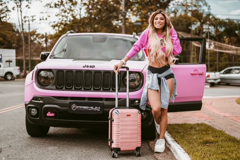 An SUV boot packed with suitcases and luggage