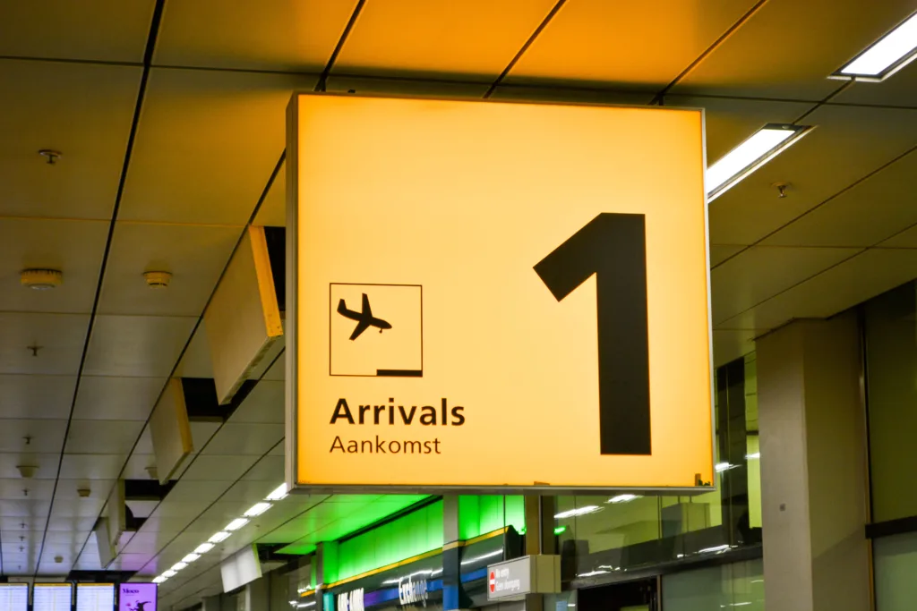 Airport arrivals hall where families meet travellers