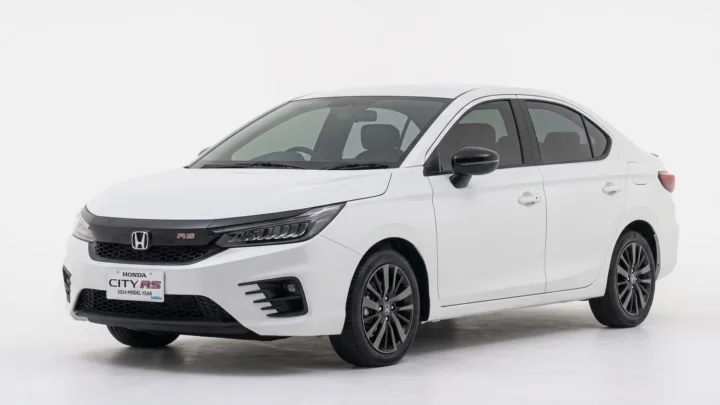Honda City, white saloon, studio photograph on a plain background